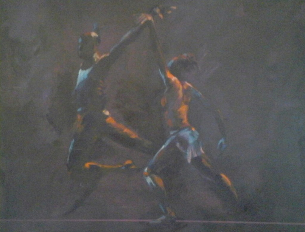 man and woman dancing together dark background