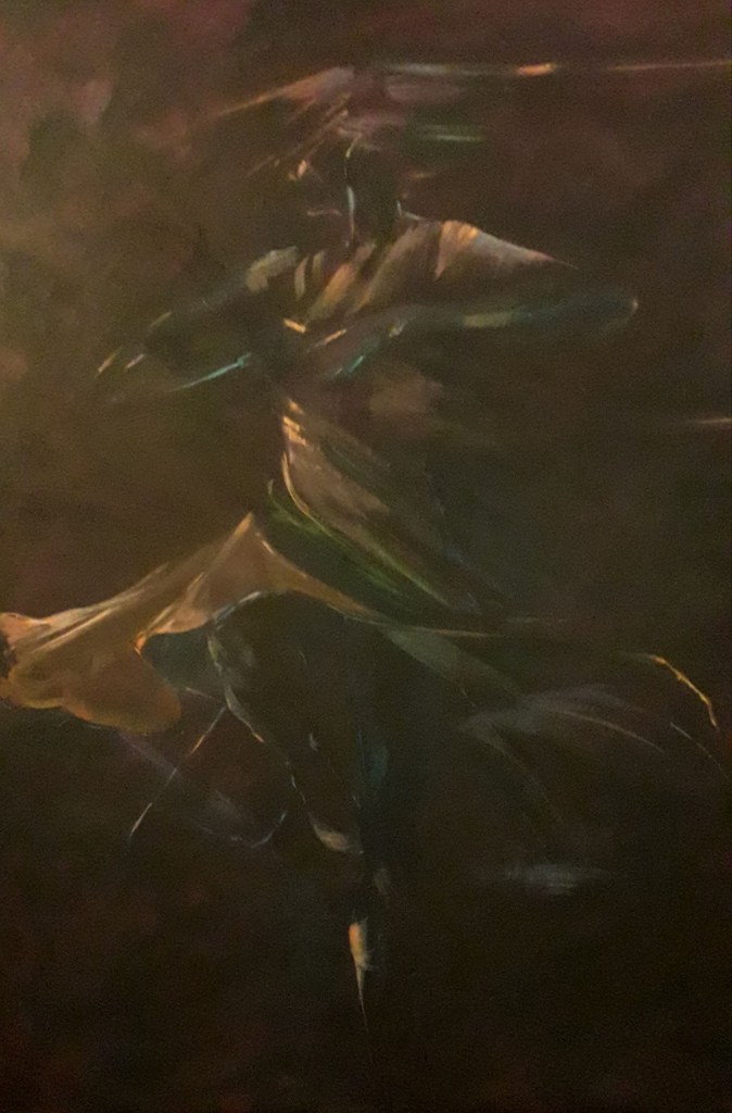 female dancer spinning brown background